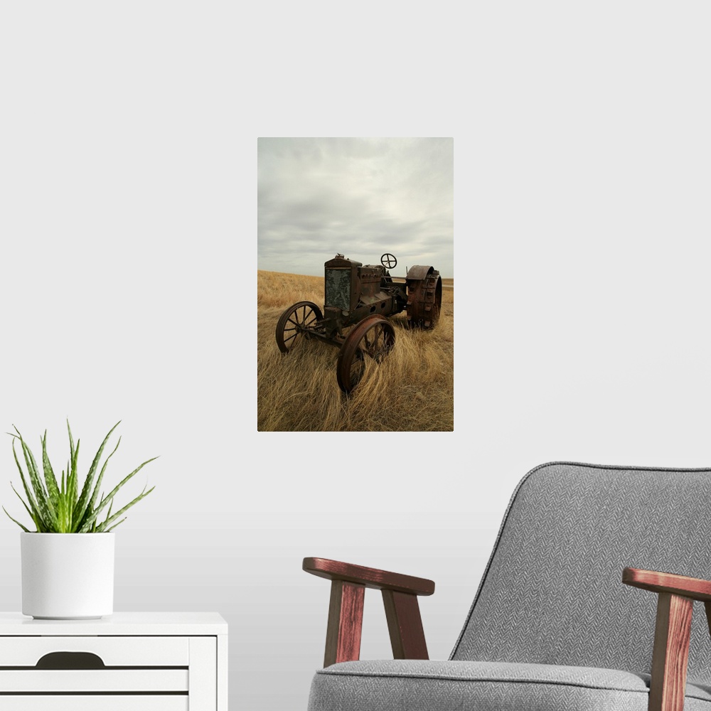 A modern room featuring Rusty Tractor In Field