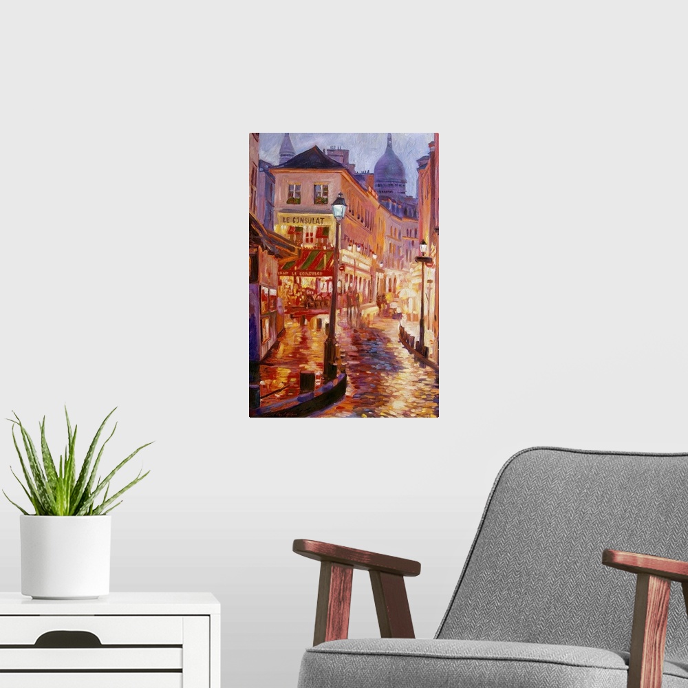 A modern room featuring Painting of a European city street glowing from the street lights at night.