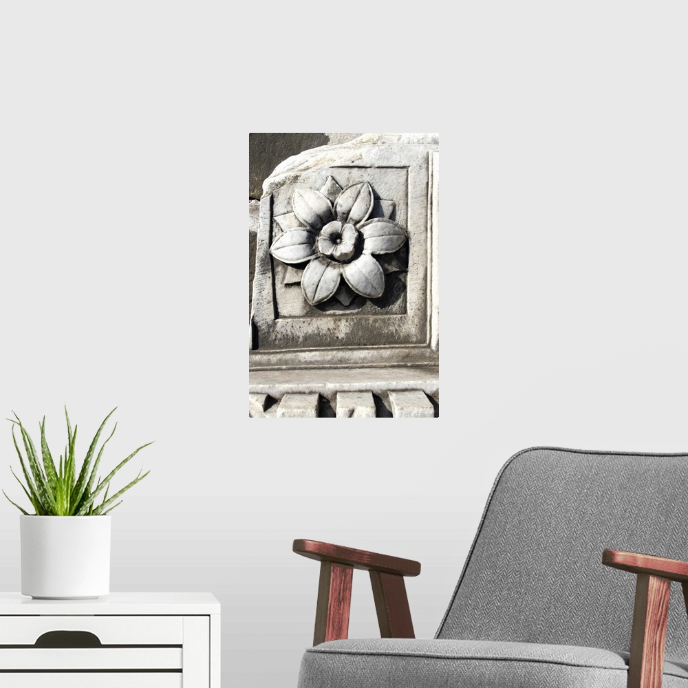 A modern room featuring Marble, travertine, decoration representing a flower. Follen to the ground from arch or temple ce...