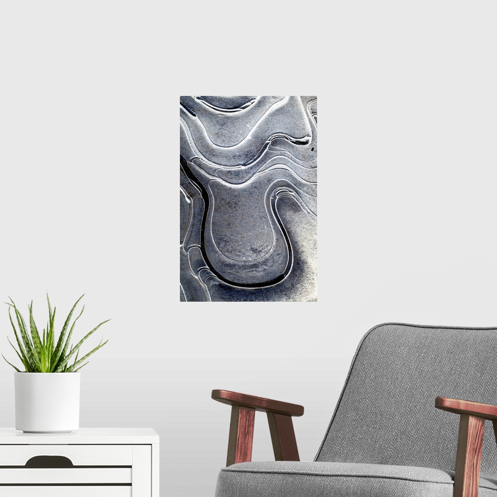 A modern room featuring This is a fine art photograph of curving shapes and monochromic sheens of bright to dark on a ver...