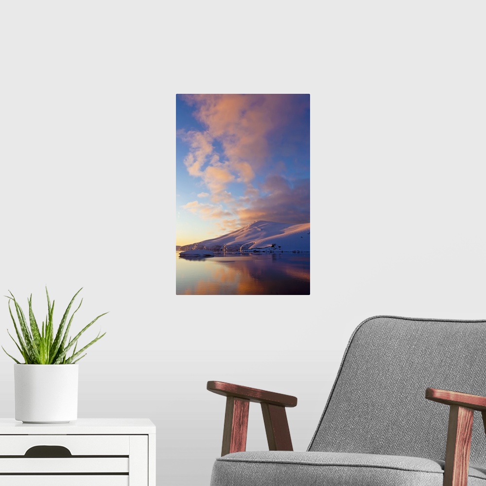 A modern room featuring Sunset over coastal mountains, Lemaire Channel, Antarctica.