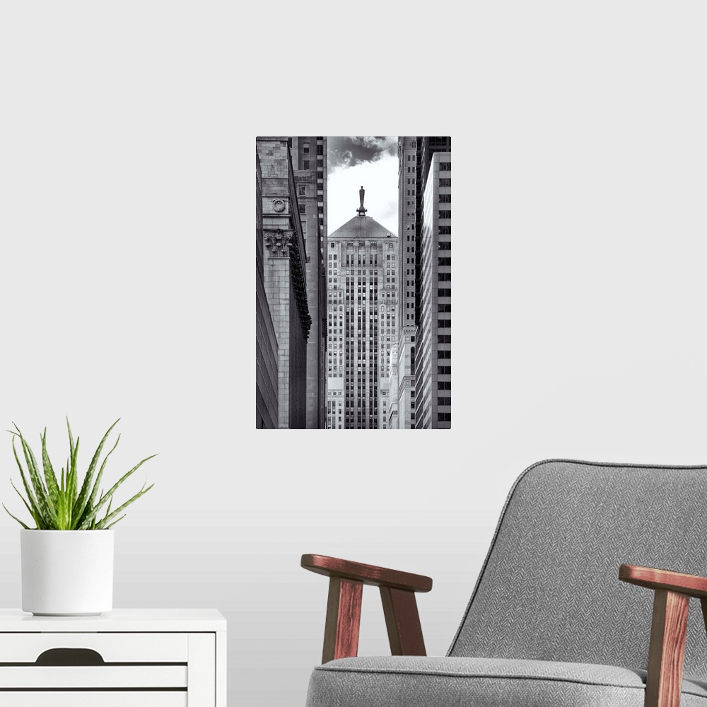 A modern room featuring Black and white photograph through a narrow way through tall buildings in Chicago.