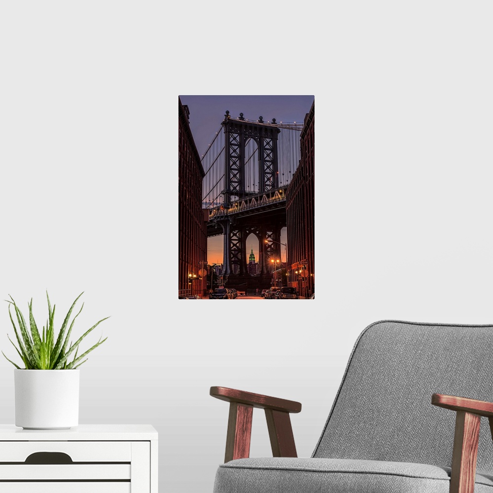 A modern room featuring A photograph of the Manhattan bridge at twilight.