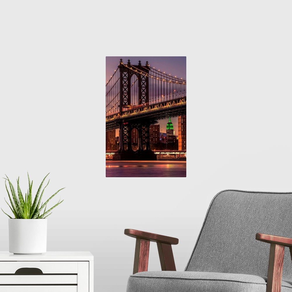 A modern room featuring A photograph of the Manhattan bridge at twilight.