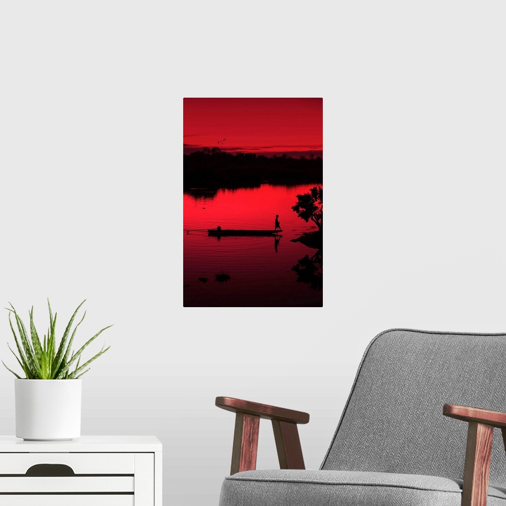 A modern room featuring A boat on the Mekong photographed with a red filter