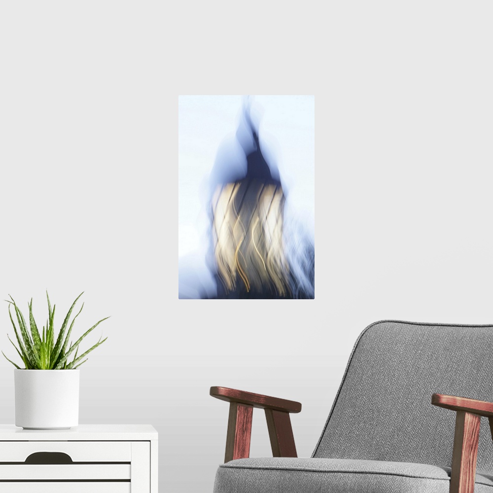 A modern room featuring Artistically blurred photo. The light of an old lighthouse gives you a safe guidance into the dar...
