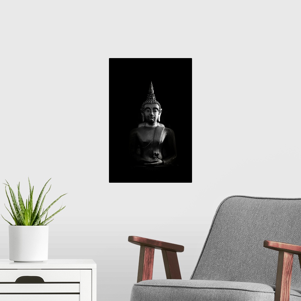 A modern room featuring Buddha bust in black and white