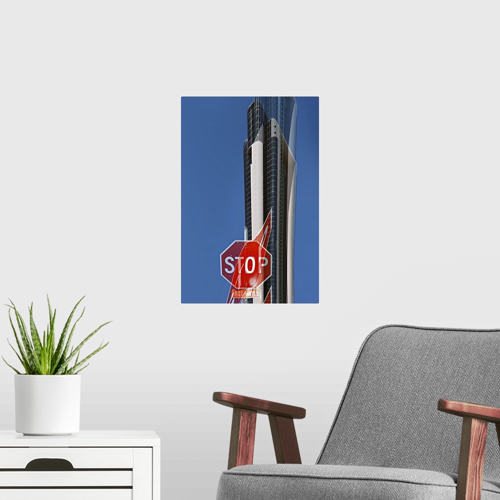 A modern room featuring Image of a stop sign and a skyscraper in the distance, with a warped version layered over it.