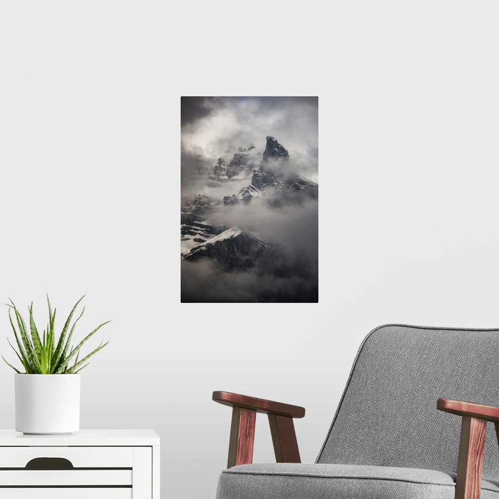 A modern room featuring French Alpes, Foggy mountain in snow close up.