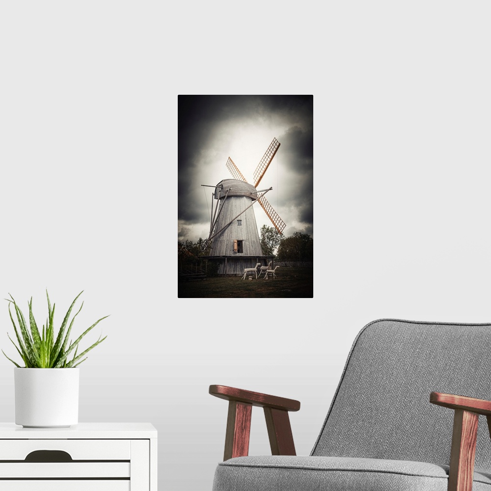 A modern room featuring Old windmill close up with stormy sky
