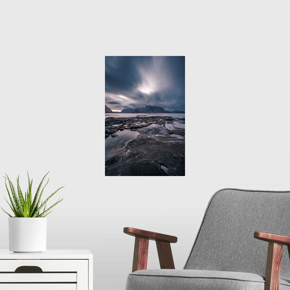 A modern room featuring Dramatic cloud movement from long exposure in central Lofoten islands, an archipelago within the ...