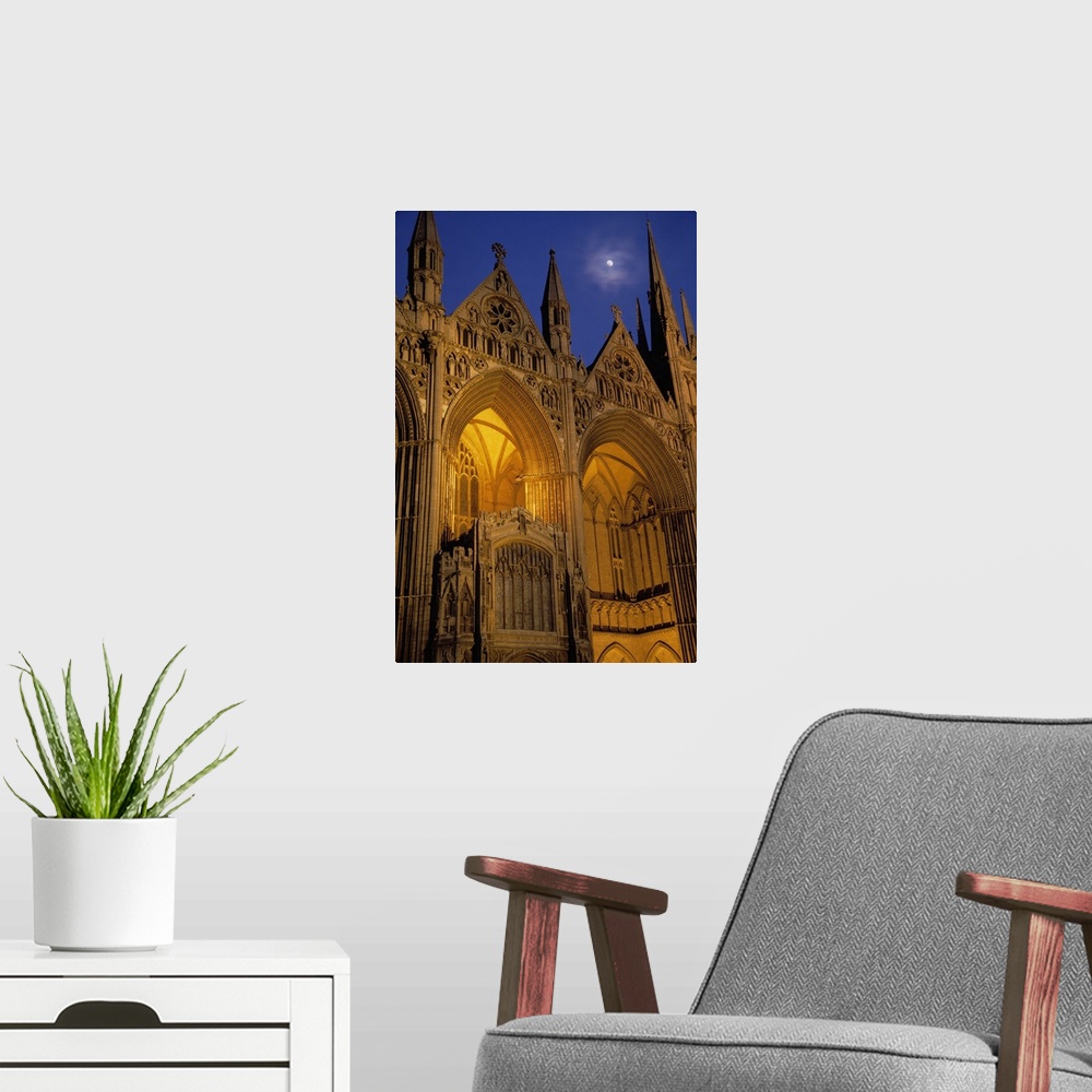 A modern room featuring Moon over Peterborough Cathedral illuminated at night, Peterborough, England.