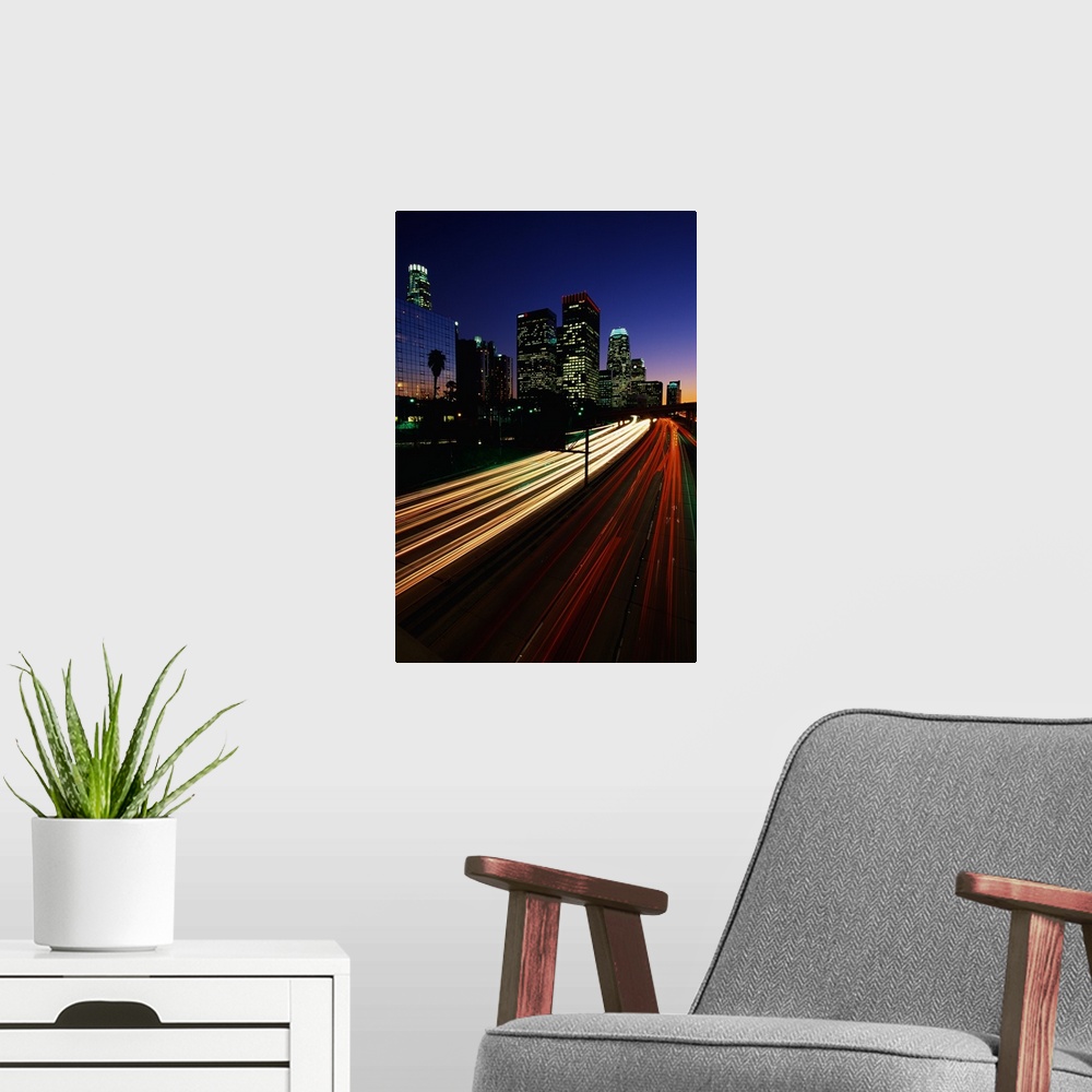 A modern room featuring Vertical photograph of the light trails of cars on the Harbor Freeway in Los Angeles, California ...
