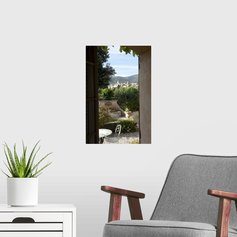 A modern room featuring Village viewed through from a window of a house, Lourmarin, Luberon