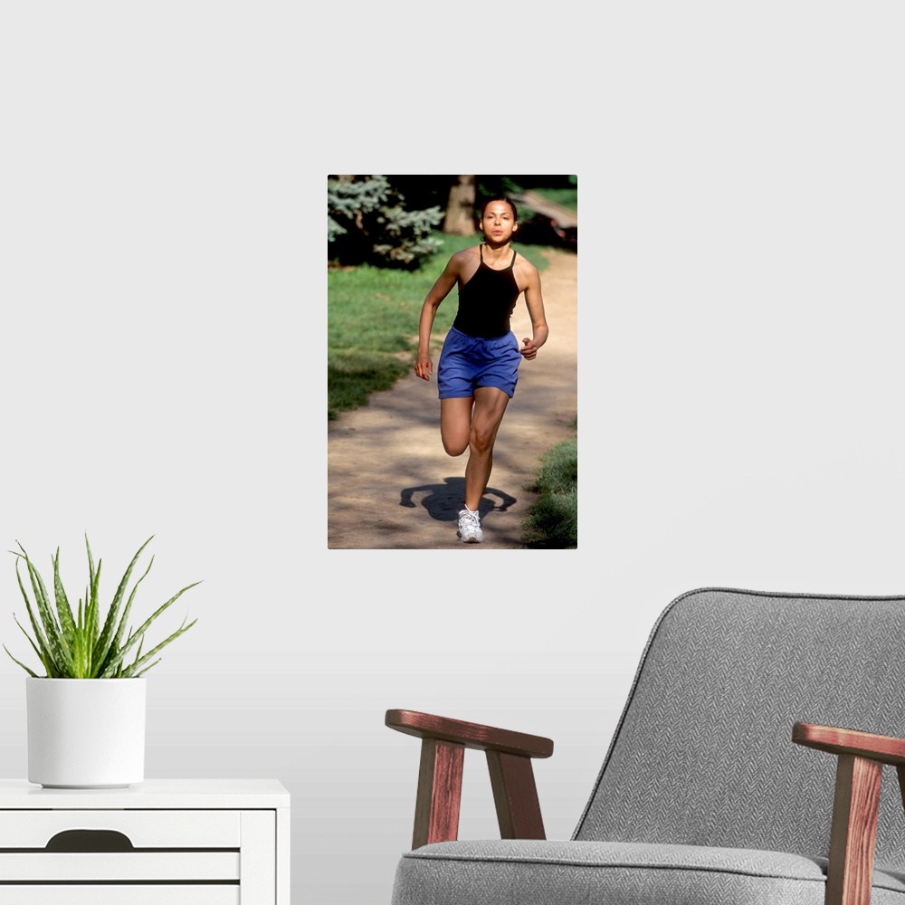 A modern room featuring Hispanic woman running for exercise