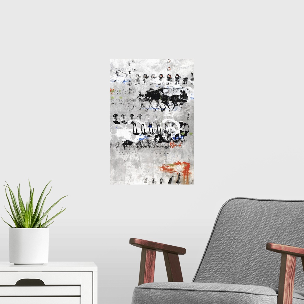 A modern room featuring Large abstract painting with a gray and white background and sporadic circular and non-uniform sh...