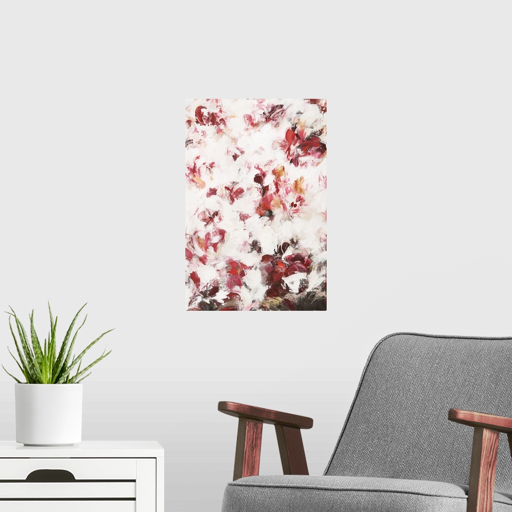 A modern room featuring Large abstract painting with warm shades of red, pink, and orange with white on top and brown a t...
