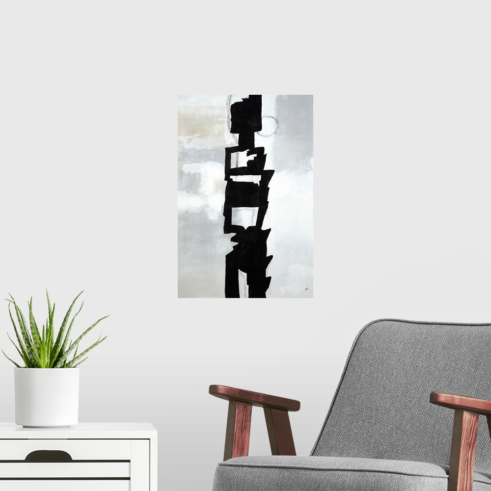 A modern room featuring Large vertical painting of a black abstract shape in the center of a gray background.
