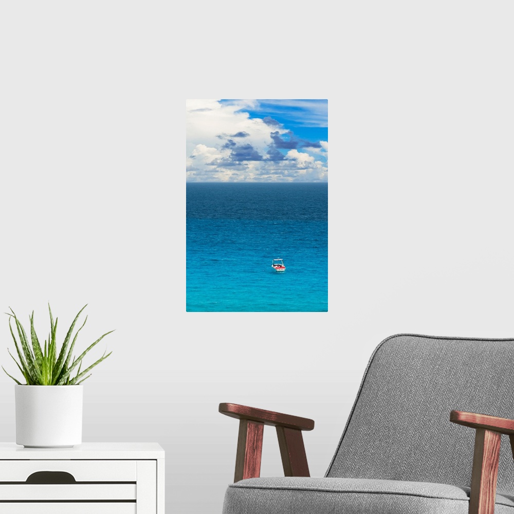 A modern room featuring Photograph of a single boat on the clear blue sea. From the Viva Mexico Collection.