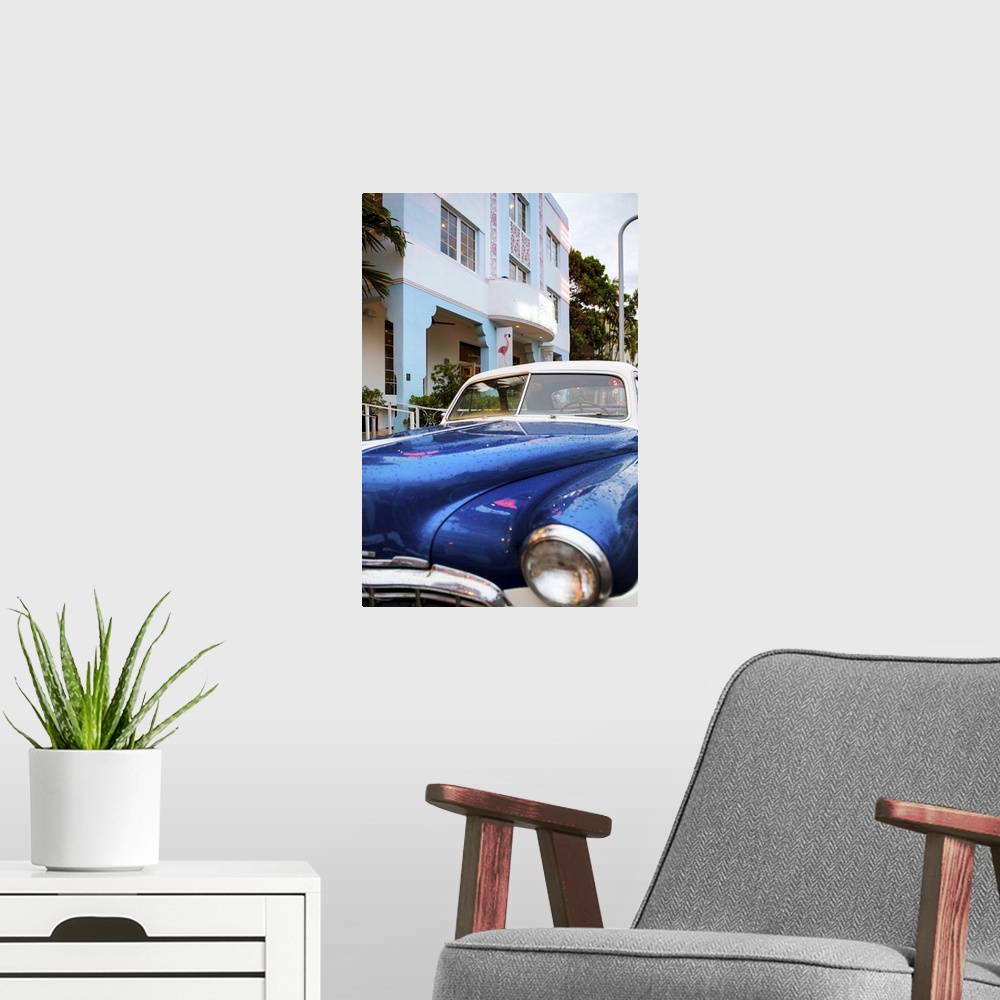 A modern room featuring Photograph of a classic car in Miami, Florida, by an art deco style building.