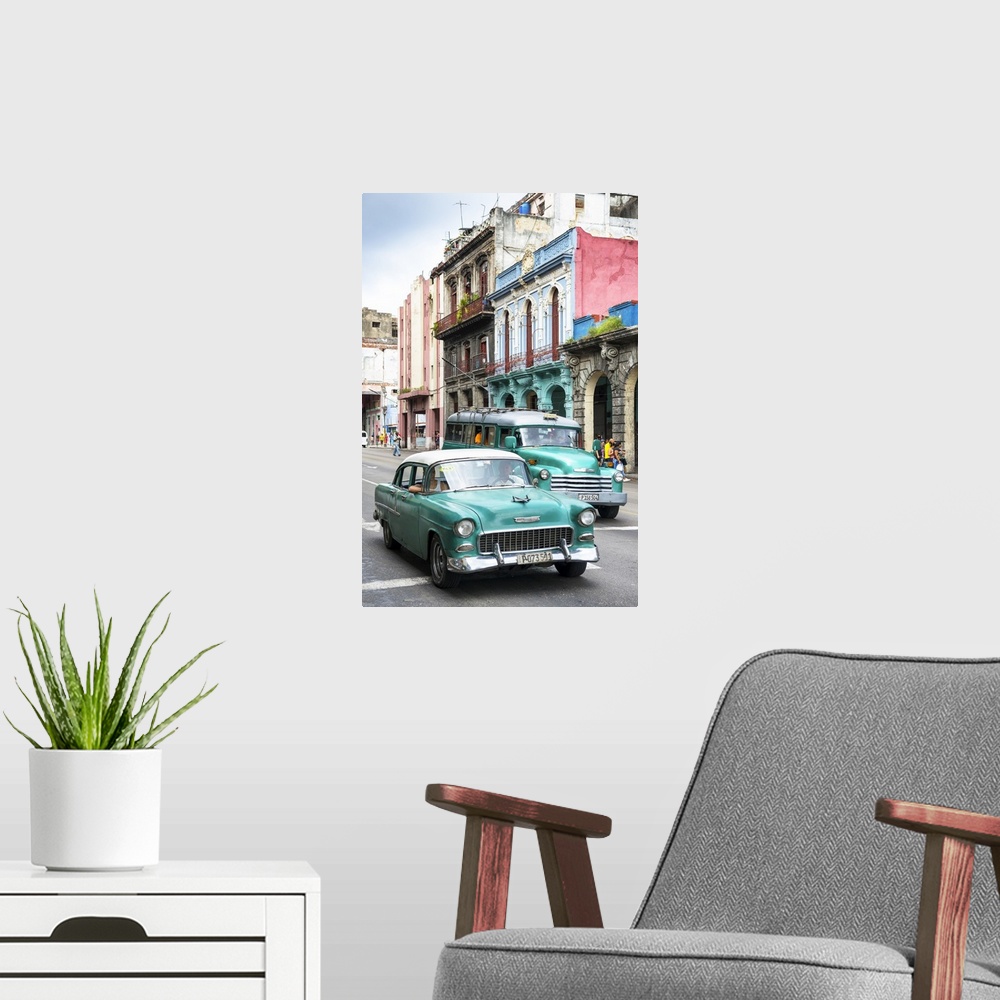 A modern room featuring Photograph of two green vintage Chevrolets in a Havana street scene.