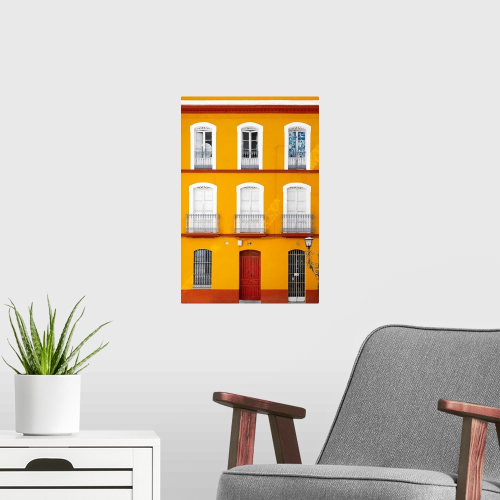 A modern room featuring It's a beautiful orange facade of an old building in Seville, Spain.
