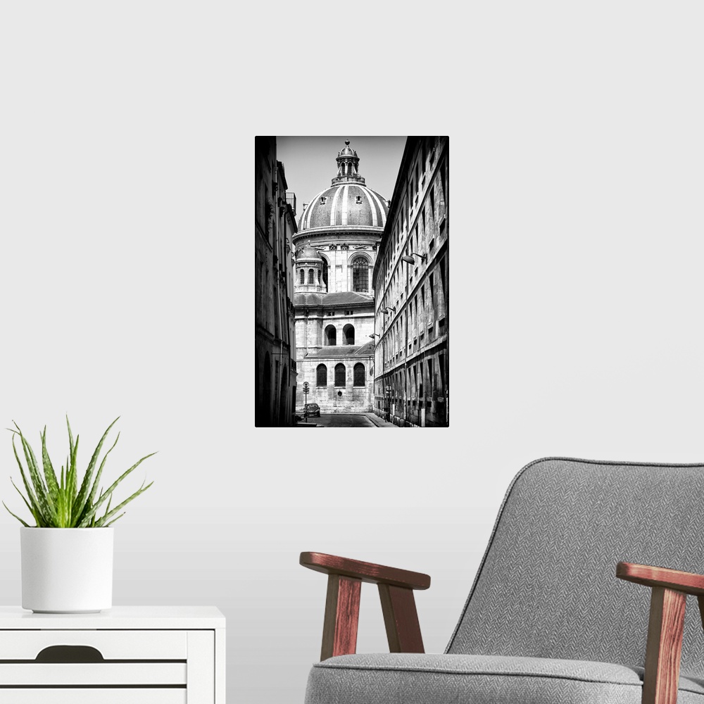 A modern room featuring A black and white photograph of a domed Parisian building.