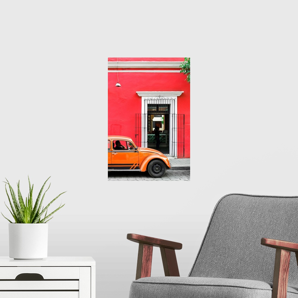 A modern room featuring Photograph of a classic orange Volkswagen Beetle in front of a red building, Mexico. From the Viv...