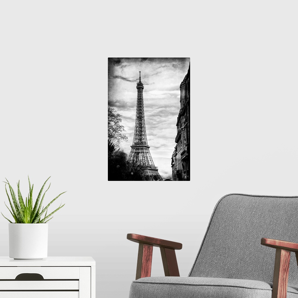 A modern room featuring View of the famous Eiffel Tower monument in Paris, France, against an overcast sky.
