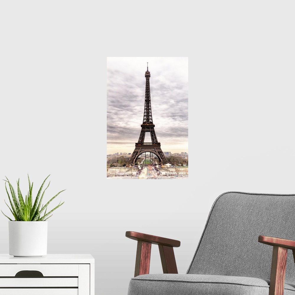 A modern room featuring Stunning photograph of the iconic Eiffel Tower in Paris with cloudy skies.