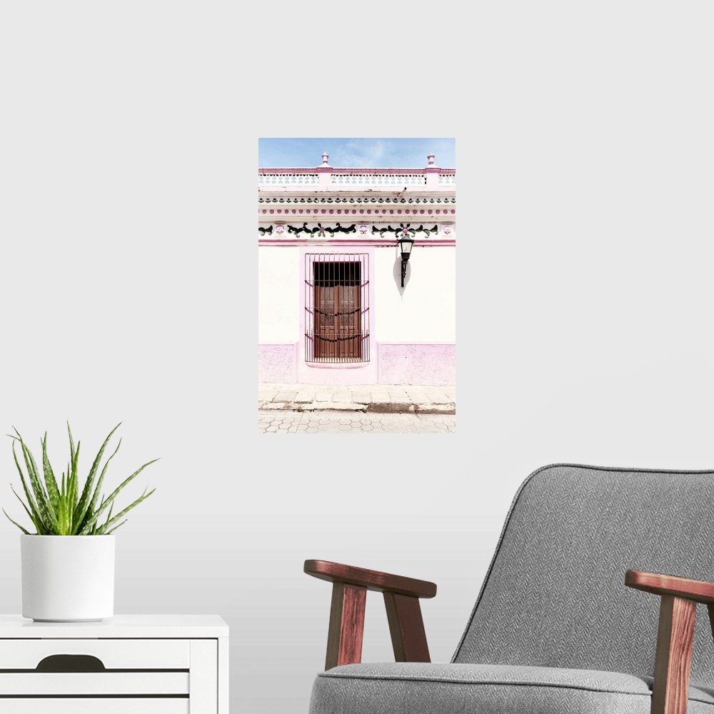 A modern room featuring Photograph of a pink and white exterior to a building with detailed designs above the window. Fro...
