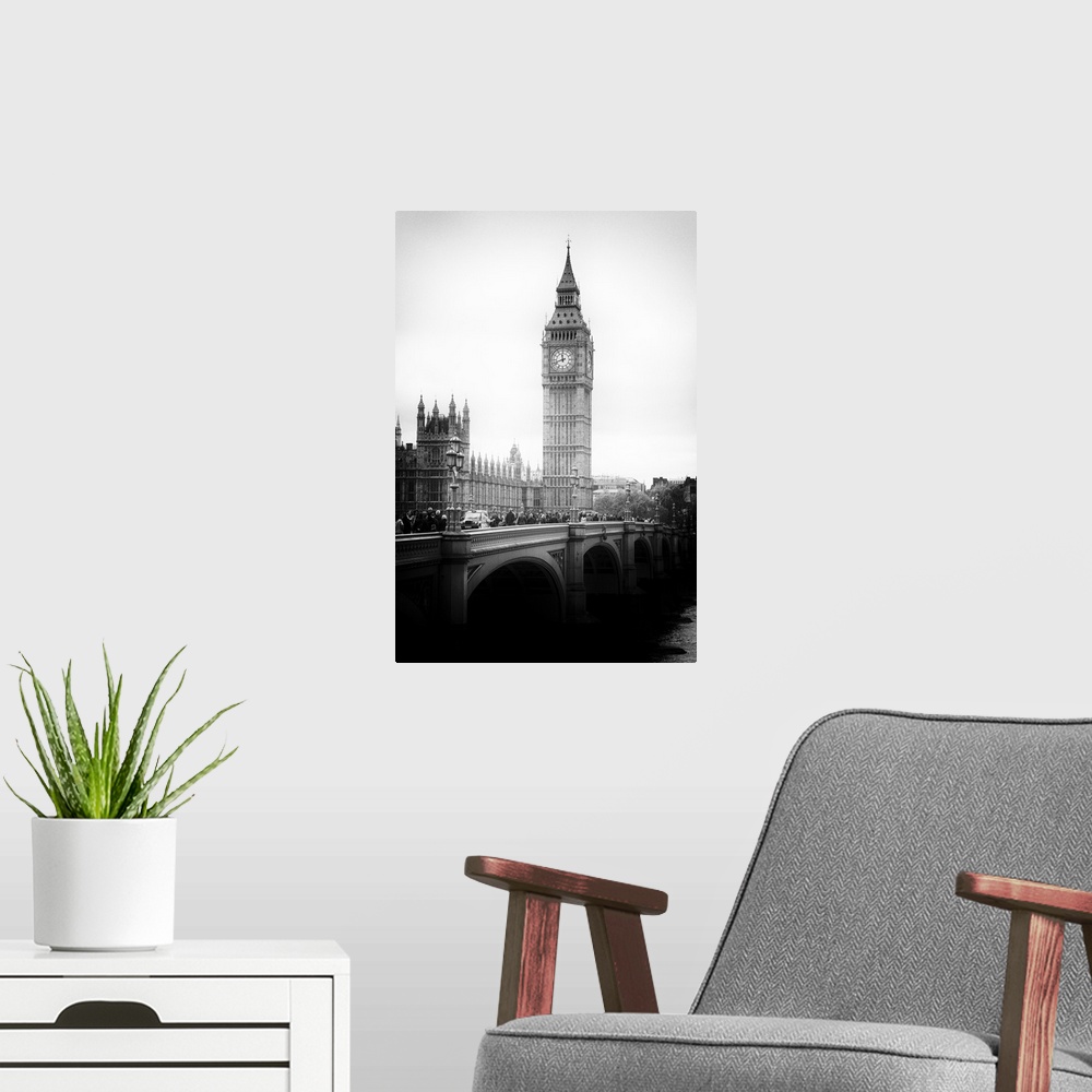 A modern room featuring Black and white photo with dramatic lighting of the Big Ben clock tower.
