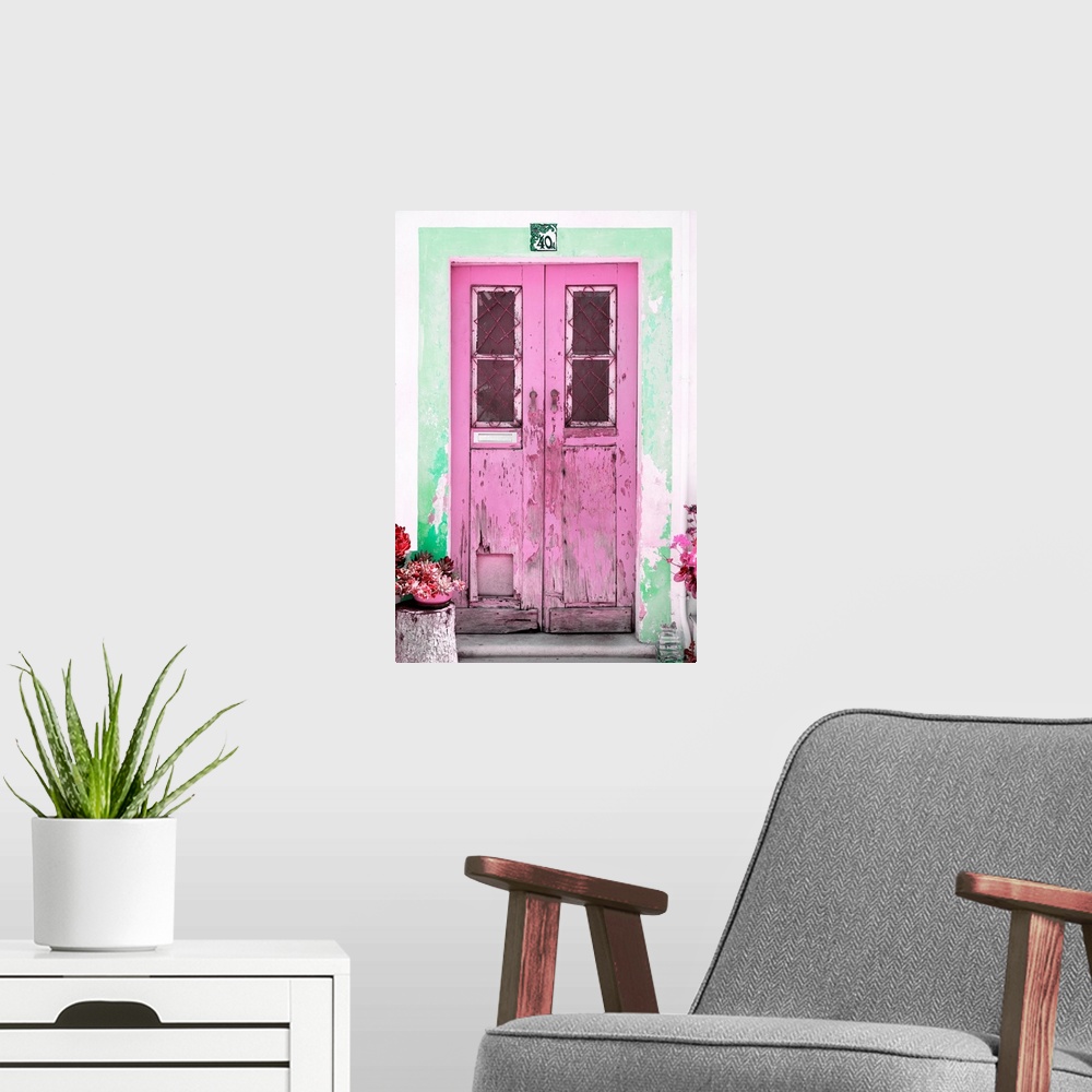 A modern room featuring It's an old pink door entrance to a traditional house in Portugal.