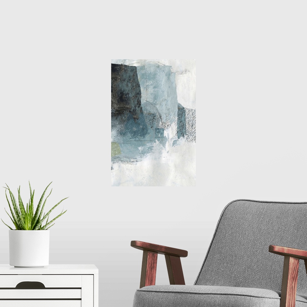 A modern room featuring Vertical abstract painting in muted colors of blue, green and gray.