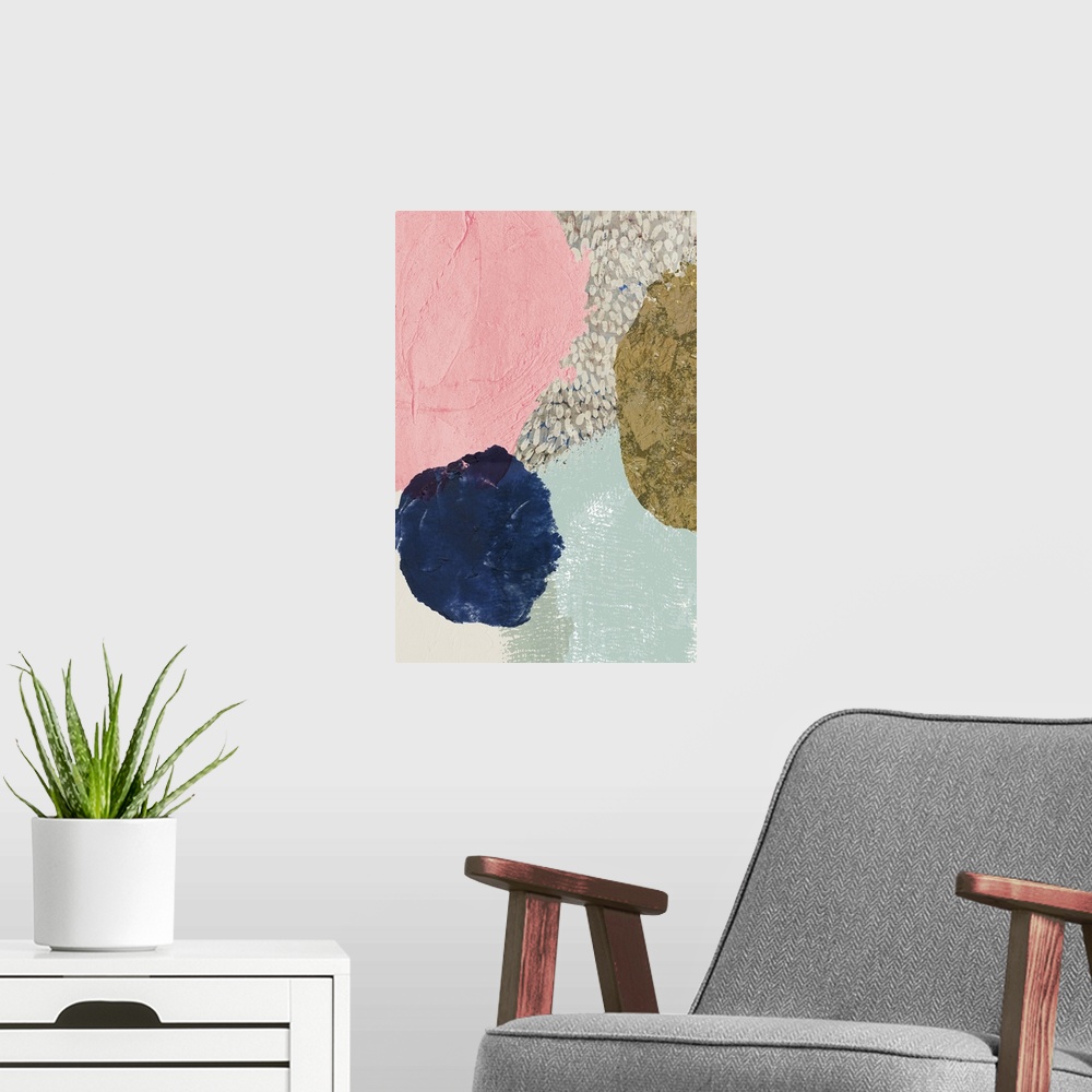 A modern room featuring Abstract artwork with circular shapes in dark navy, gold, and pink.