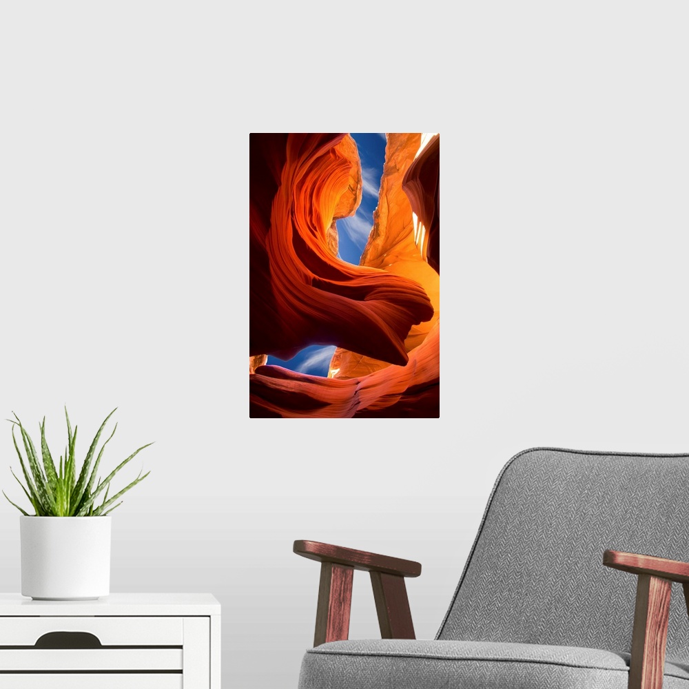 A modern room featuring Dynamic photograph of the Lady in the Wind rock formation section of Antelope Canyon, Arizona.