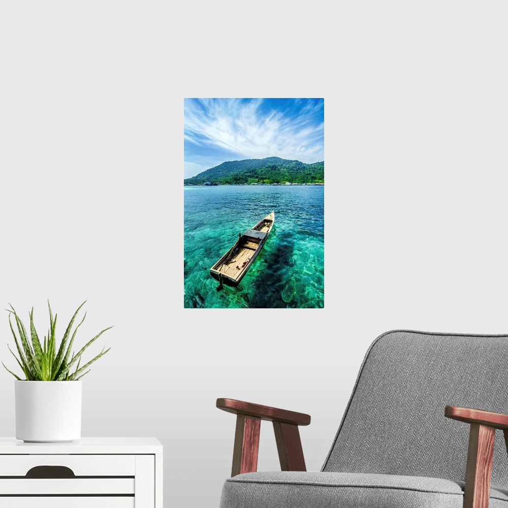 A modern room featuring A boat on the clear water near beautiful Letung Island, Indonesia.