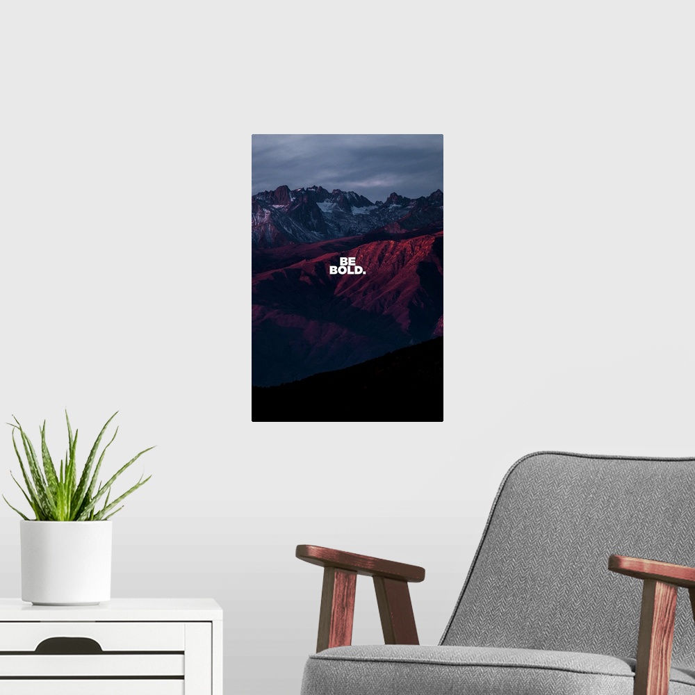 A modern room featuring Motivational sentiment over a dramatic sunset mountain view.
