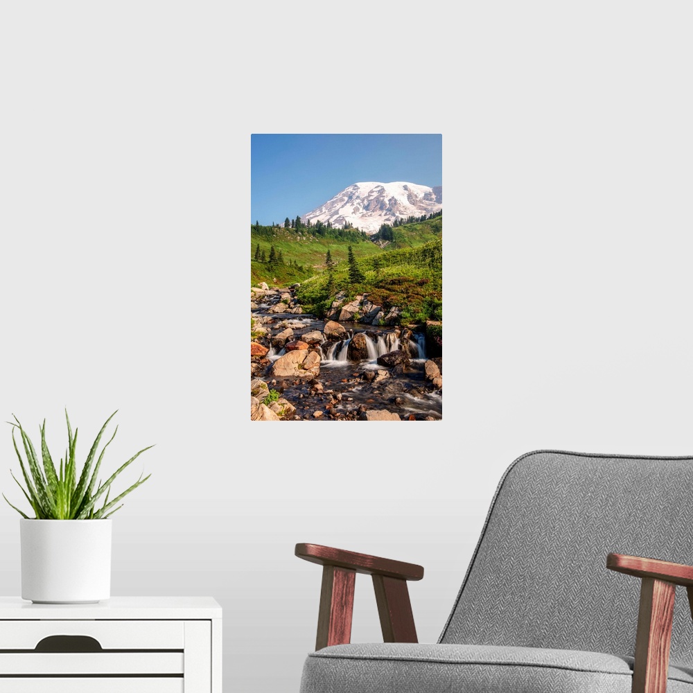 A modern room featuring View of a tranquil waterfall with Mount Rainier peak in the background, Mount Rainier National Pa...