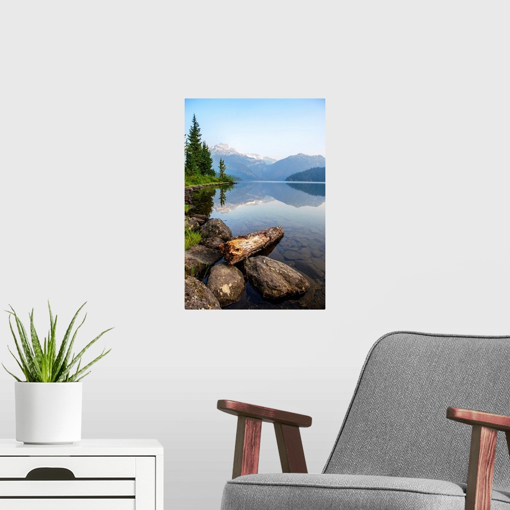 A modern room featuring Reflection on Callaghan Lake with Rocks in British Columbia, Canada.