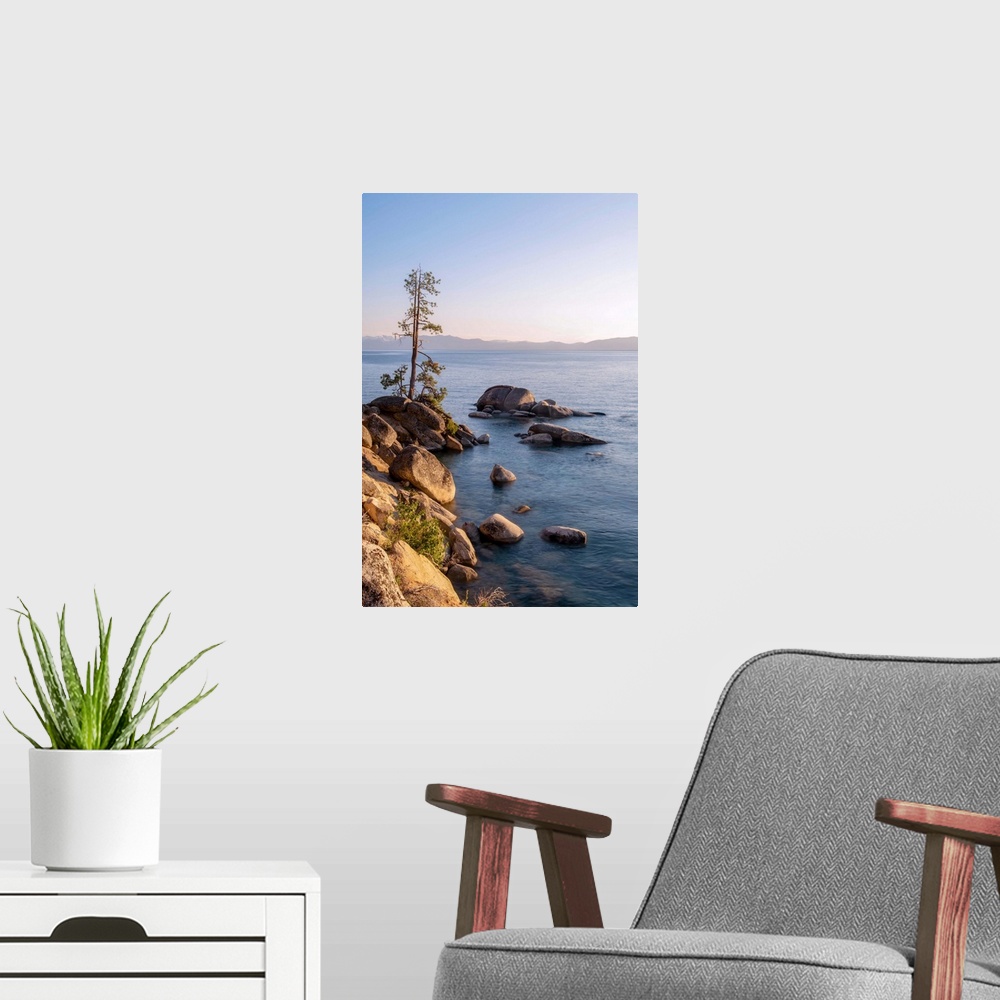 A modern room featuring View of Lake Tahoe's rocky shore in California and Nevada.