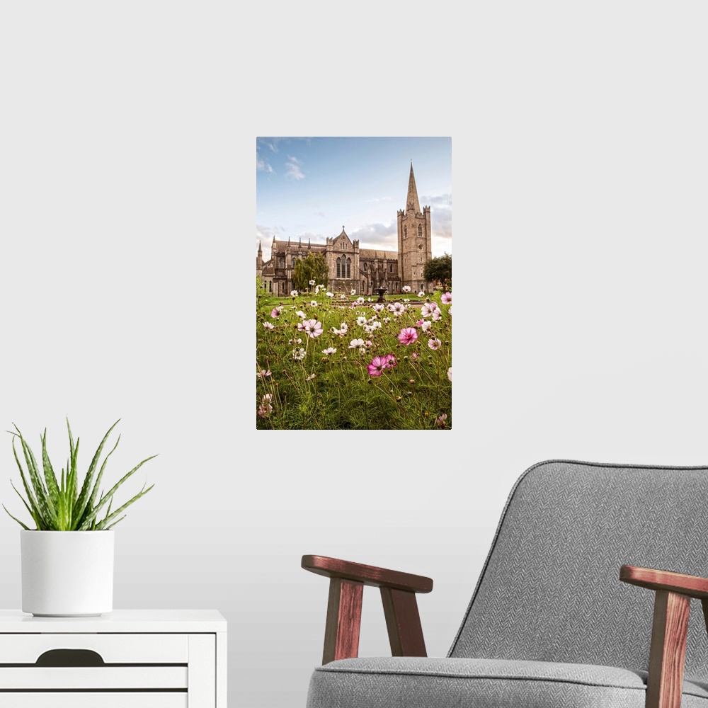A modern room featuring Photograph of St Patrick's Cathedral in Dublin, Ireland, with a field of pink and white wildflowe...