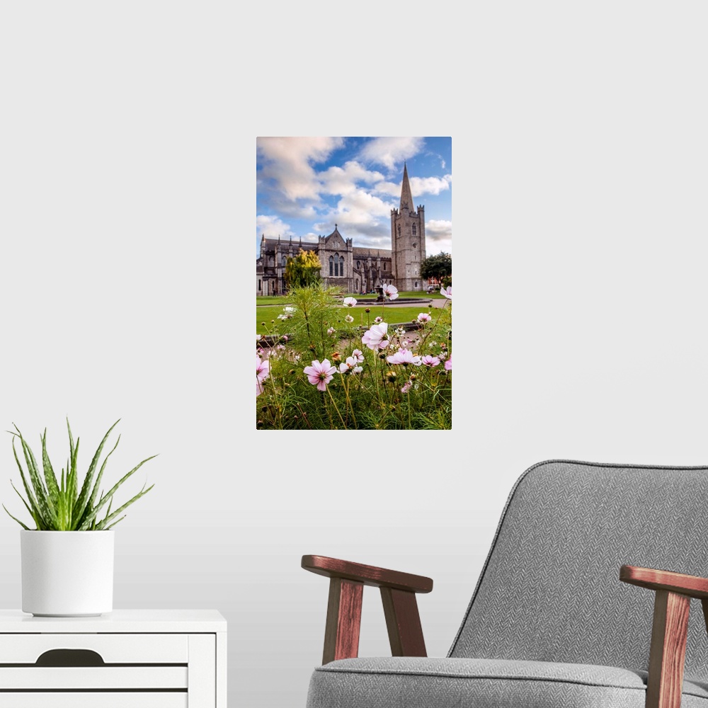 A modern room featuring Photograph of St Patrick's Cathedral in Dublin, Ireland, with a field of pink and white wildflowe...