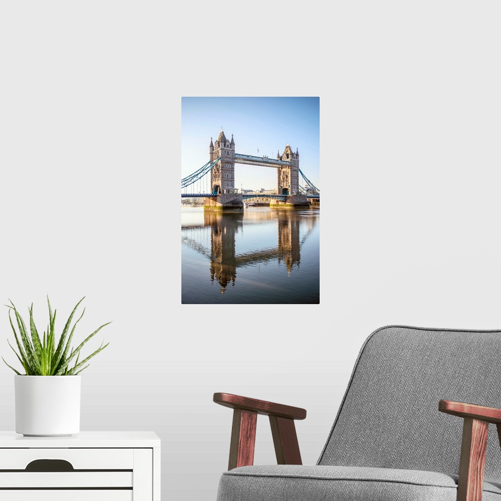 A modern room featuring Photograph of Tower Bridge reflecting into the River Thames in London, England, UK.