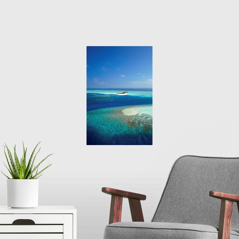 A modern room featuring Aerial view of tropical island and lagoon, Maldives, Indian Ocean, Asia