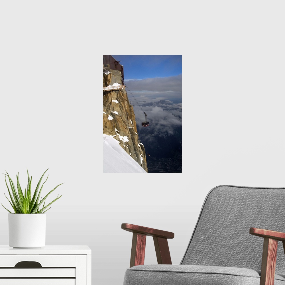 A modern room featuring Cable car approaching Aiguille du Midi summit, Chamonix-Mont-Blanc, French Alps, France