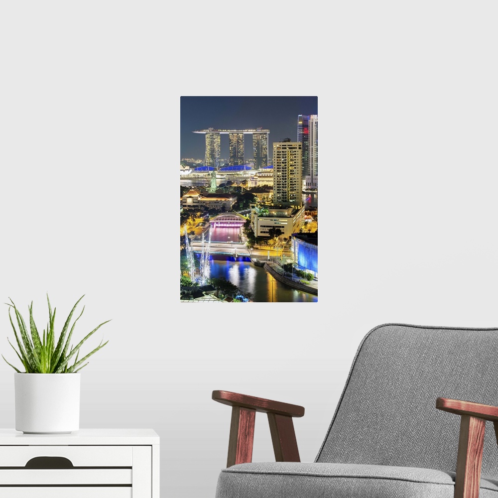 A modern room featuring Clarke Quay, the Singapore River and city skyline at night, Singapore