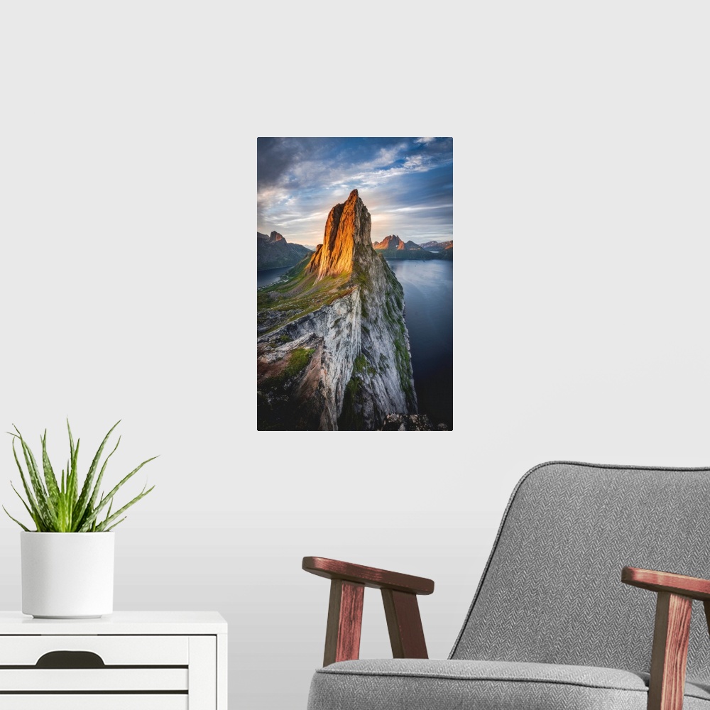 A modern room featuring Majestic Mount Segla and fjords under a cloudy sky at sunrise, Senja island,Troms county, Norway,...