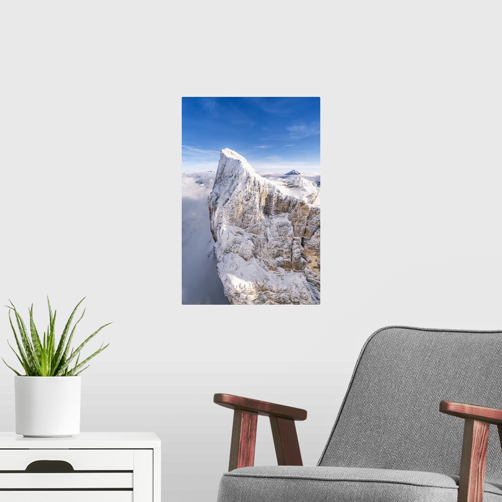 A modern room featuring Rock face of Monte Pelmo covered with snow, aerial view, Dolomites, Belluno province, Veneto, Ita...