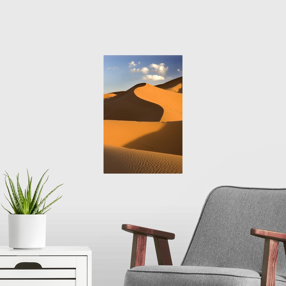 A modern room featuring Rolling orange sand dunes and sand ripples, Erg Chebbi sand sea, Morocco